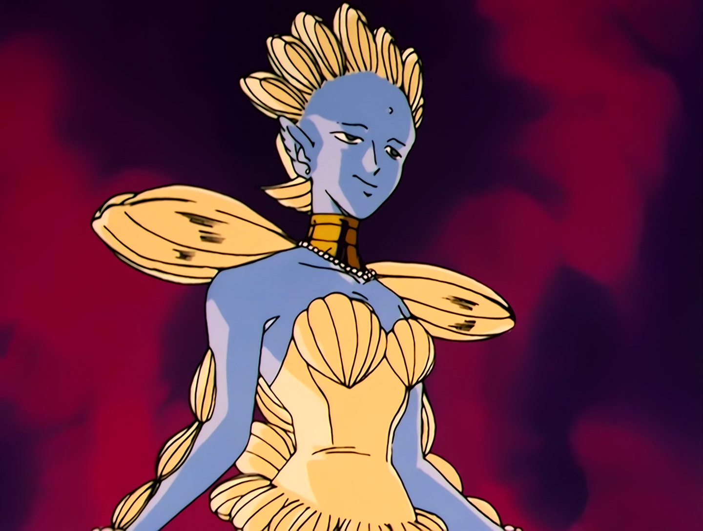 Shakoukai, a Youma from Sailor Moon episode 37. She has light blue skin, wears a gold collar, and both her dress and her hair are made of clams of various sizes. She has a kind of statue-like vibe to her.